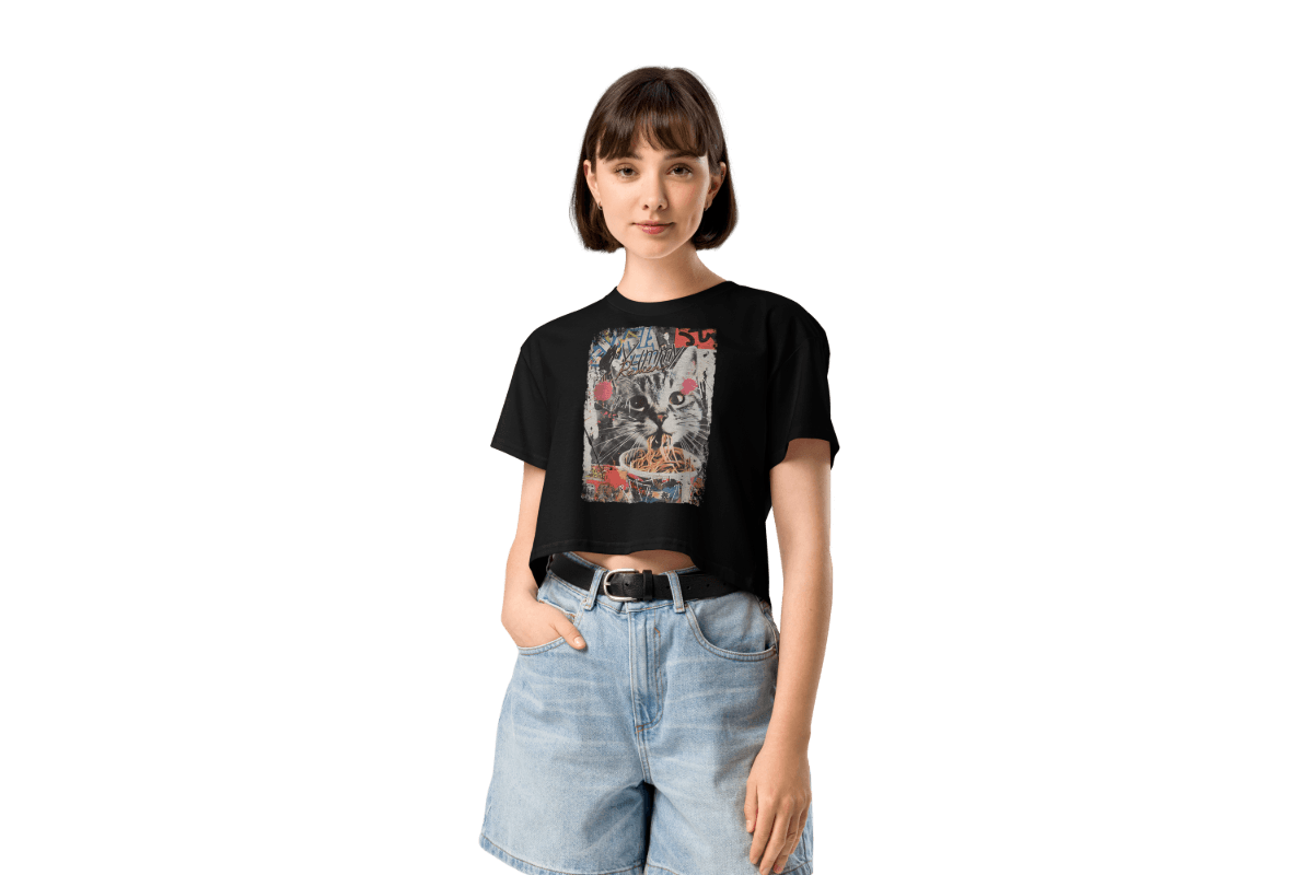 Woman wearing graphic crop top with vintage Y2K grunge cat design, aesthetic streetwear style
